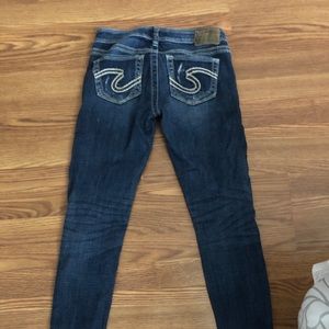 Distressed silver jeans